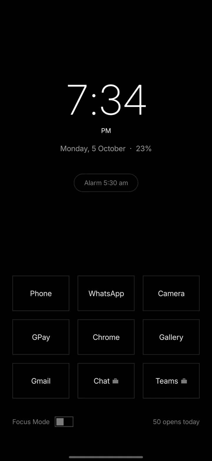 The same phone running Unlit: a digital clock and nine app names on black